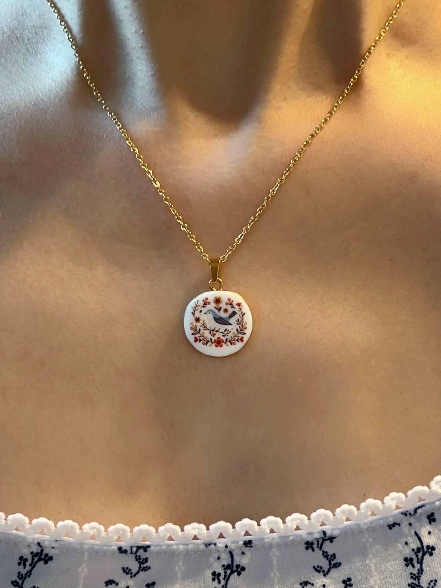 Blue bird and flowers necklace