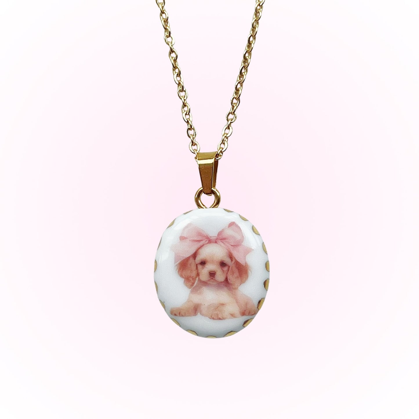 Puppy with pink bow necklace