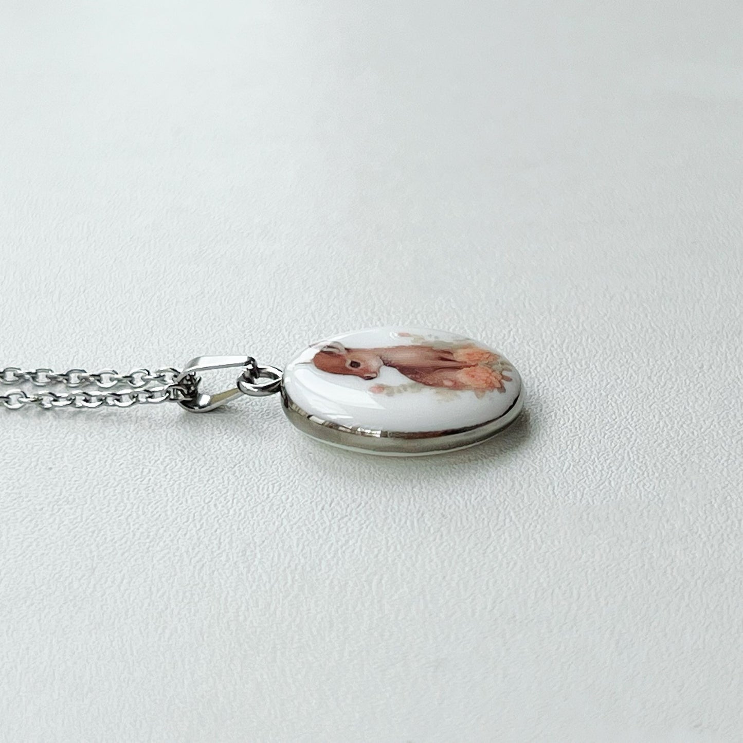 Baby deer with roses necklace