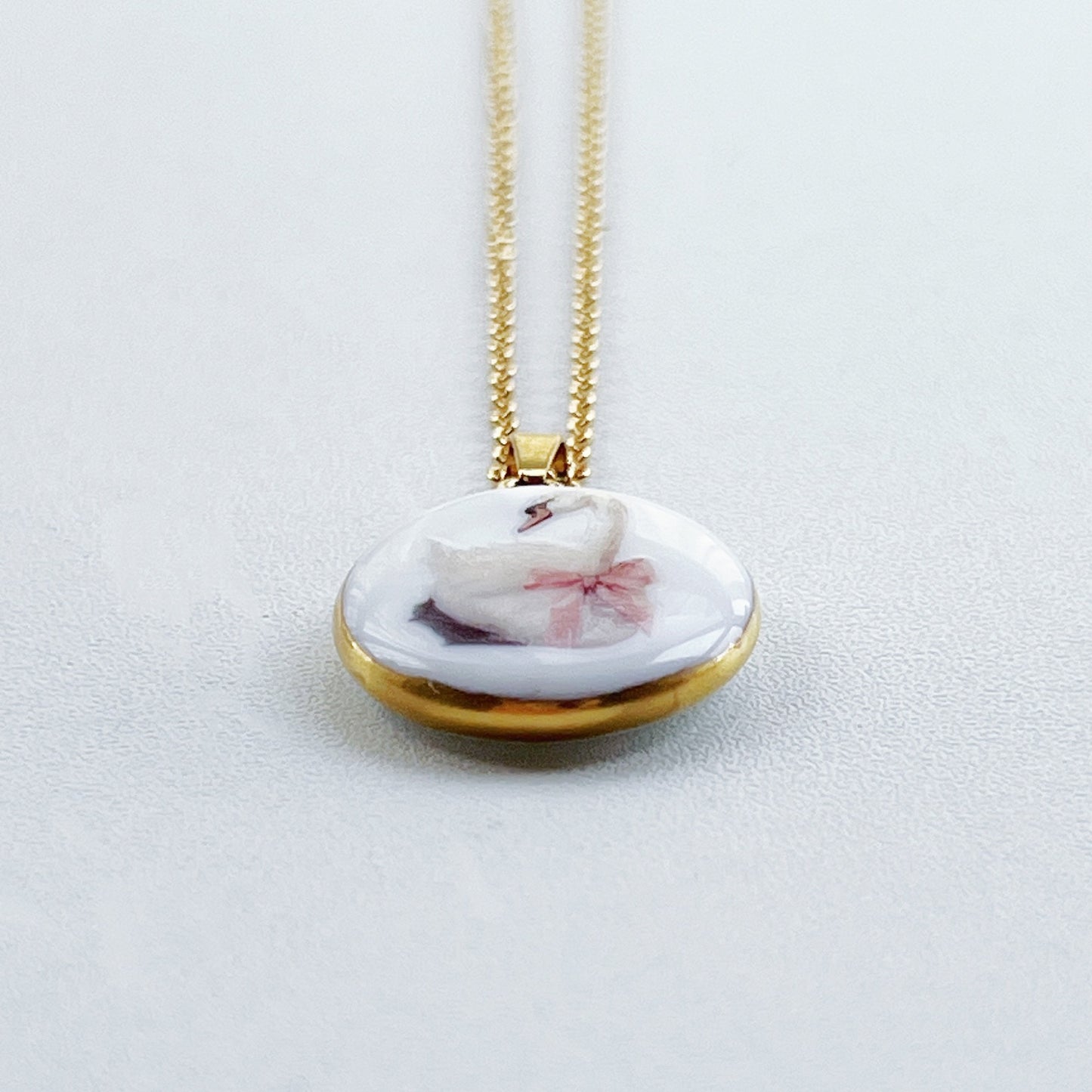 Swan with pink bow necklace