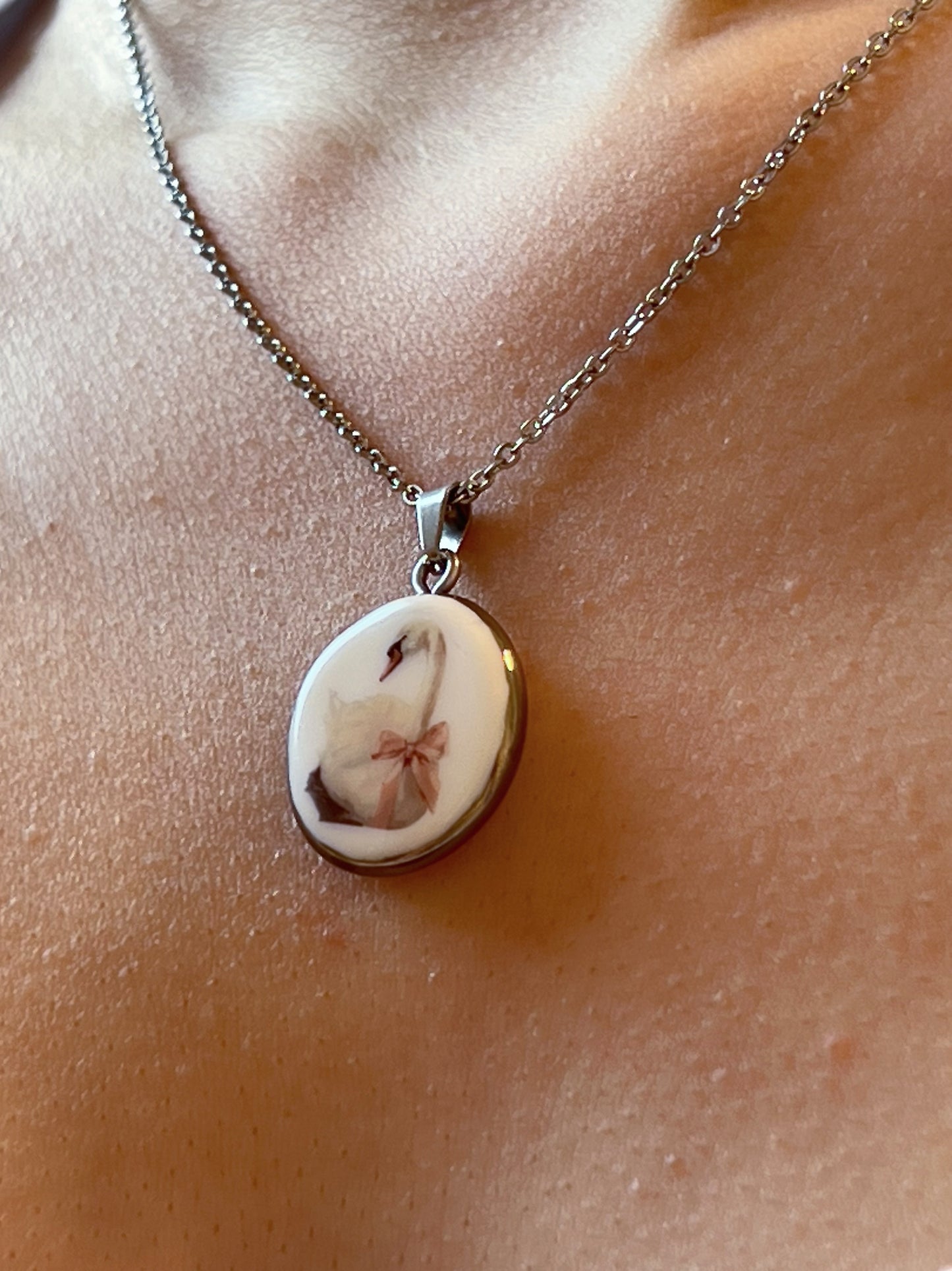 Swan with pink bow necklace