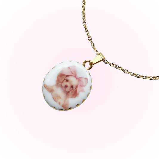 Puppy with pink bow necklace